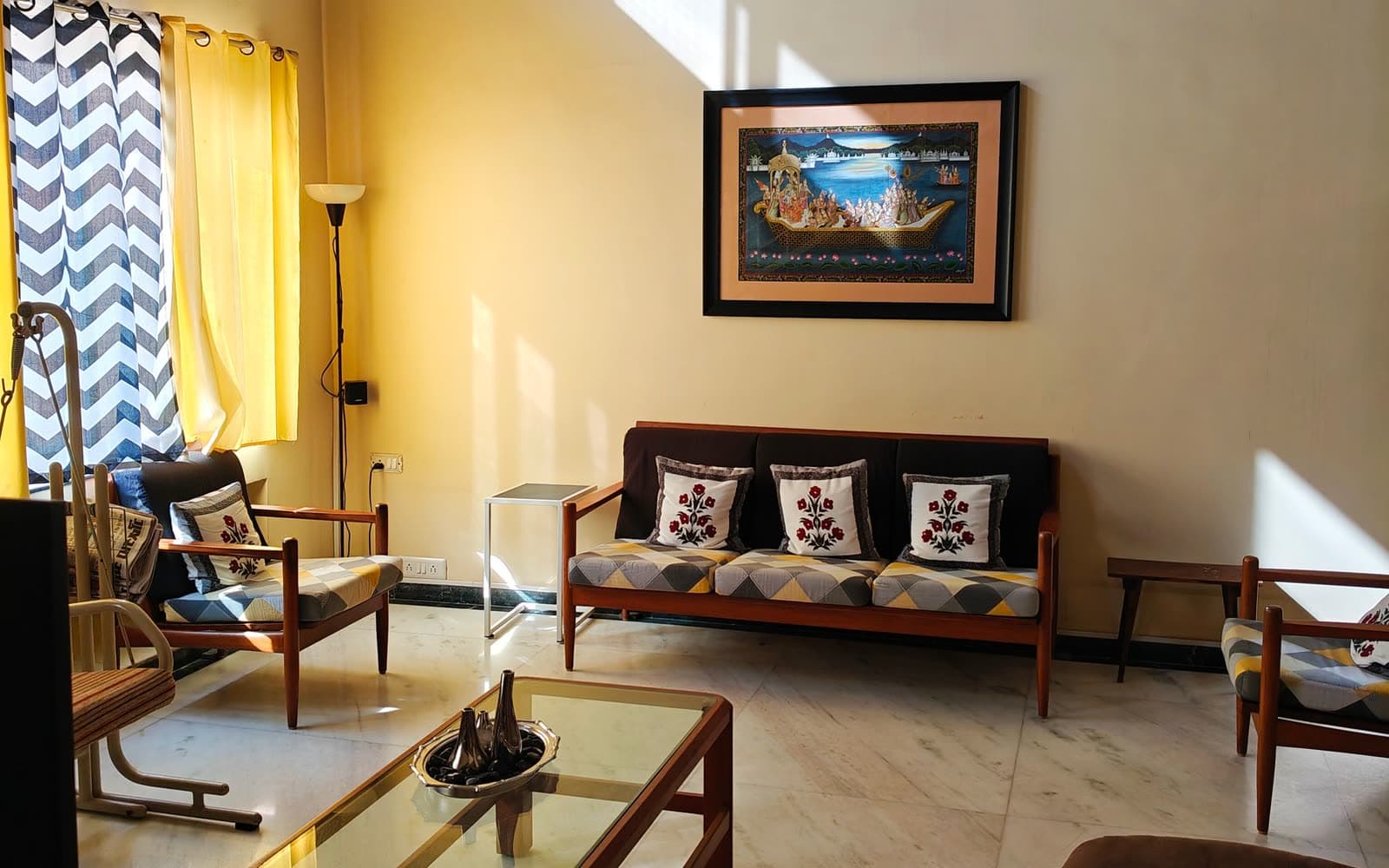 A sunlit living room in a home in Vadodara
